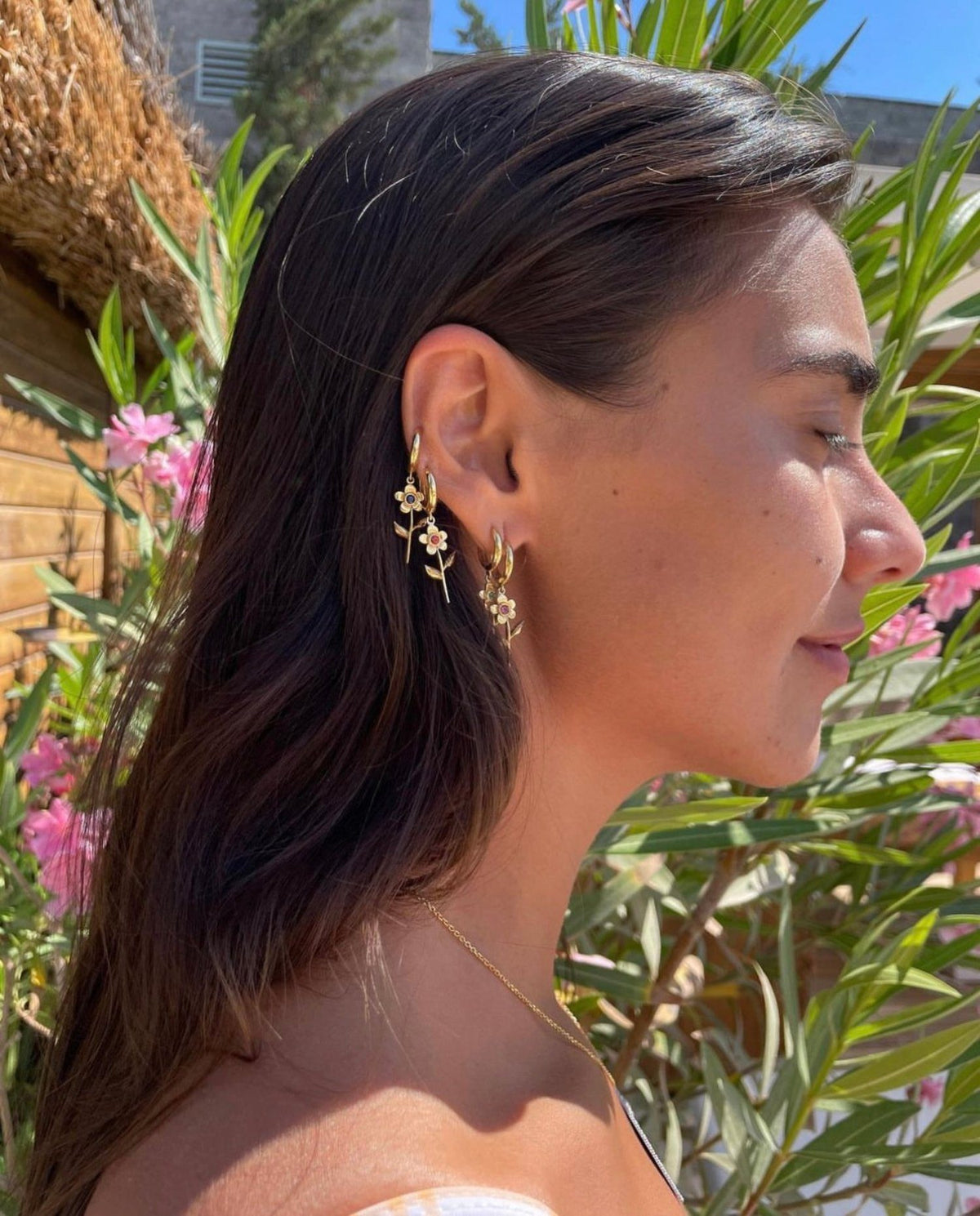 Dina Adlouni wearing stacked Karmalulu earrings