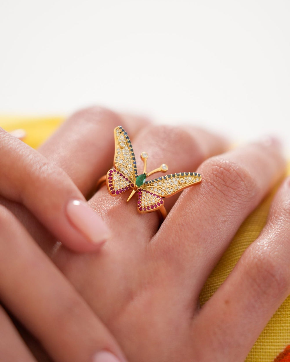 Butterfly Ring and Lion Ring in 18K gold, worn