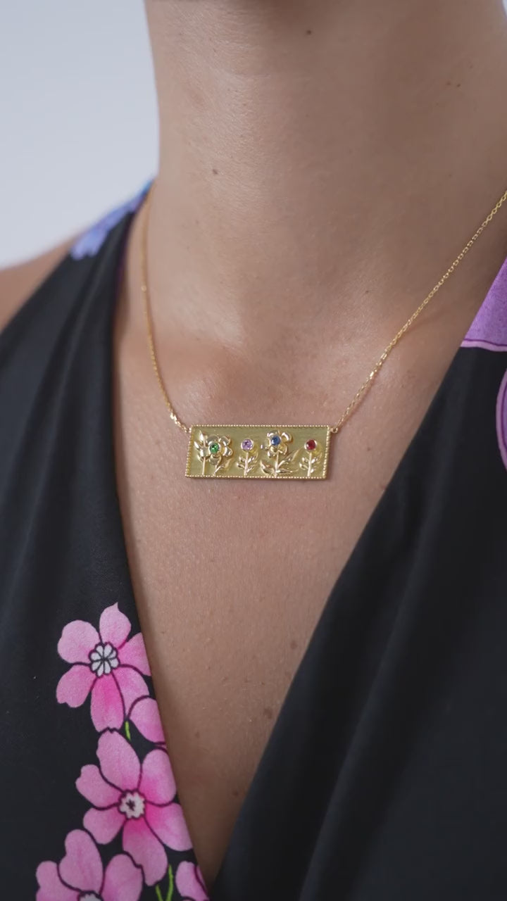 Garden of Eden Necklace in 18K yellow gold with four gemstone flowers – product video