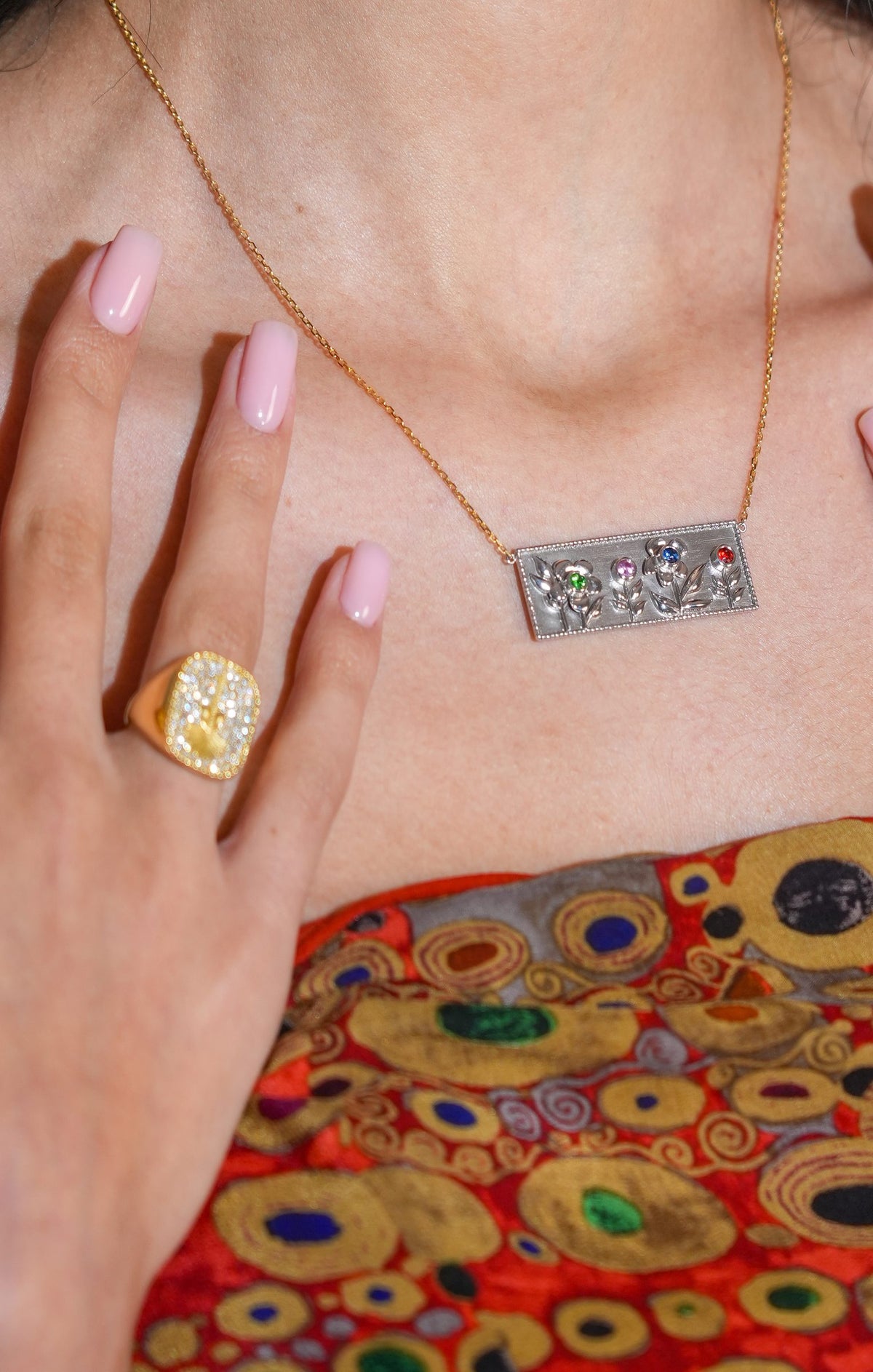 Garden of Eden Necklace in white gold worn with the Diamond Palm Tree Ring in yellow gold