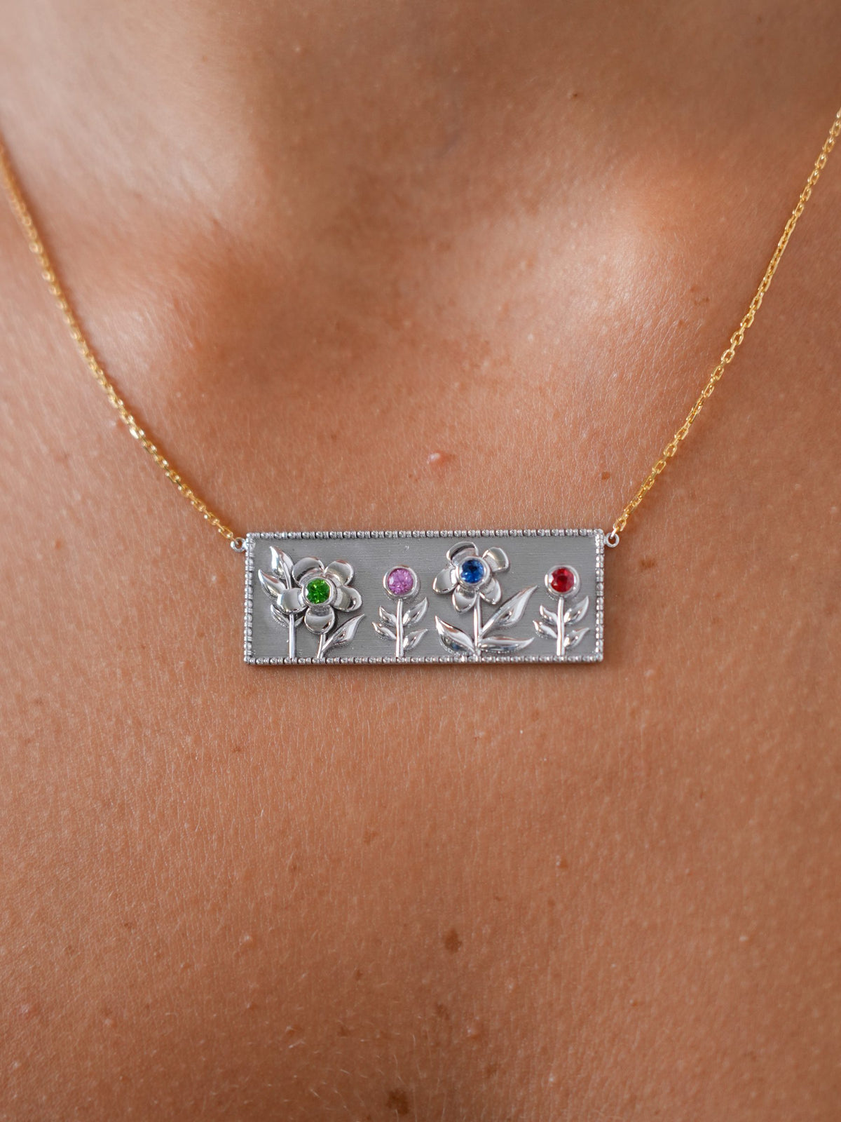 Garden of Eden Necklace in 18K white gold with four gemstone flowers